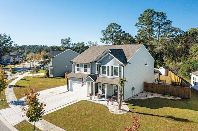 view of front of home featuring a garage and a front yard