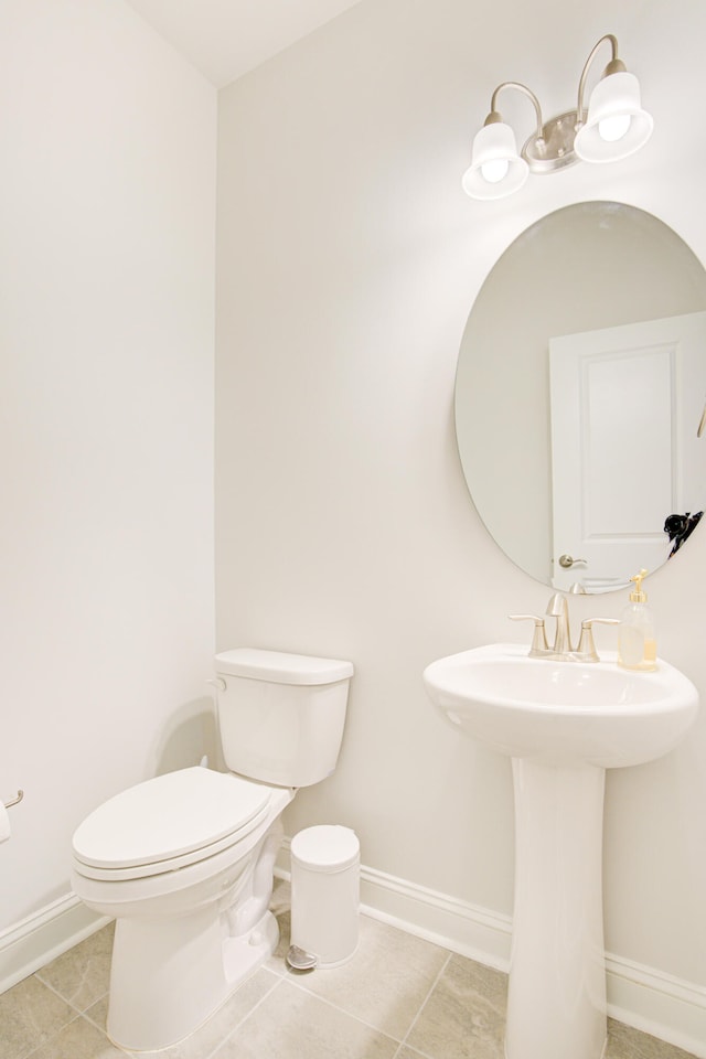 bathroom featuring tile patterned floors and toilet