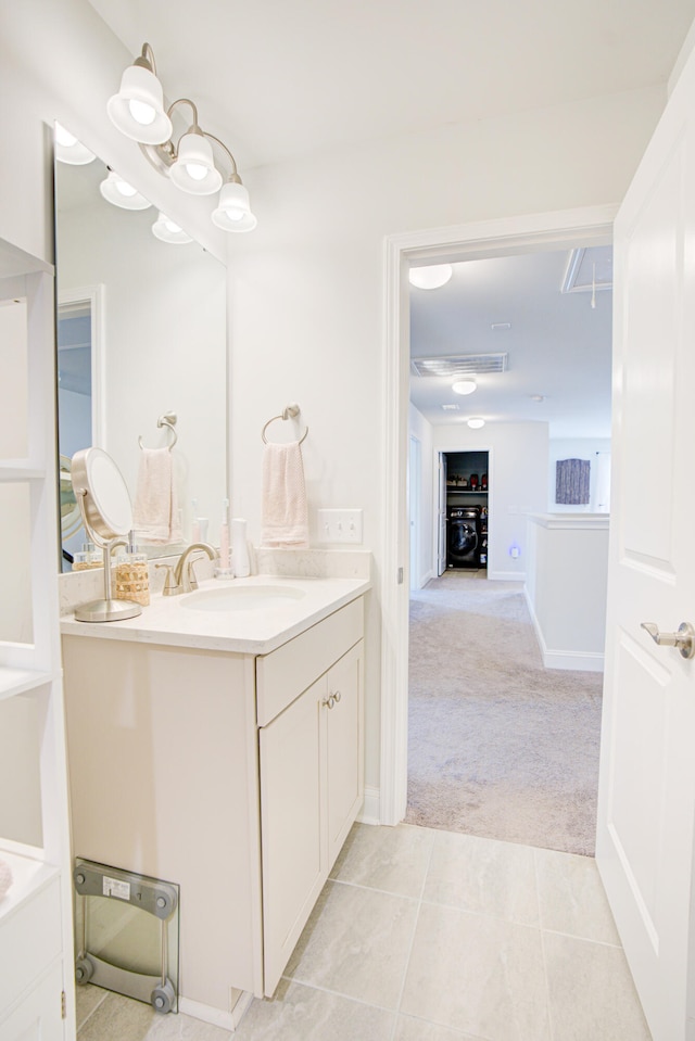 bathroom with tile patterned flooring and vanity