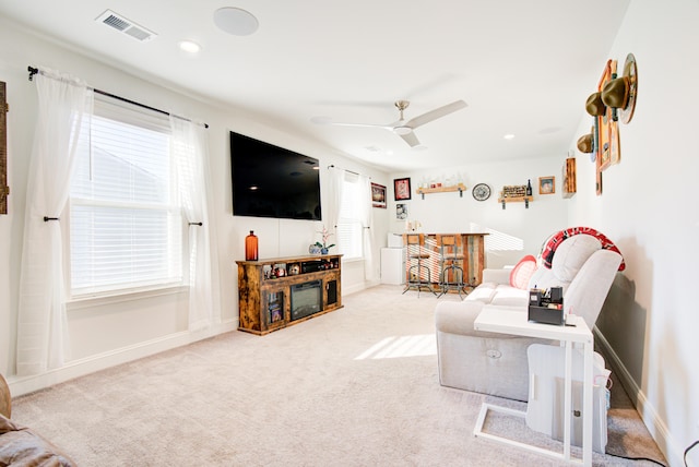 living room featuring ceiling fan and carpet floors