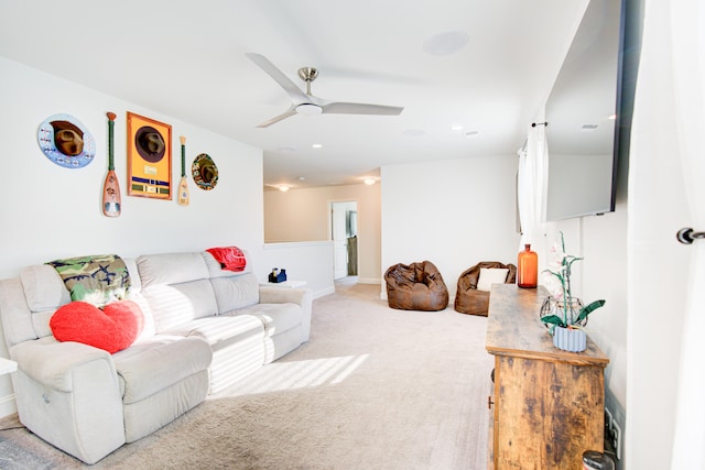 carpeted living room featuring ceiling fan