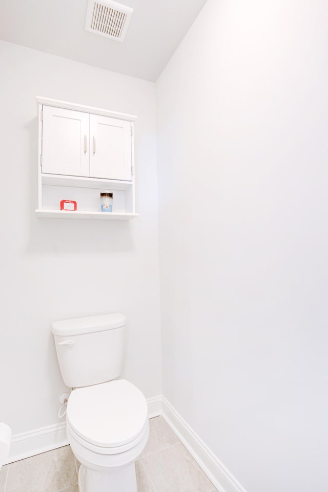 bathroom featuring tile patterned floors and toilet