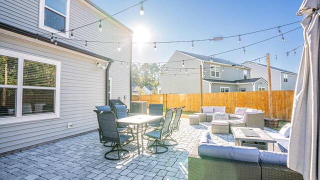 view of patio with an outdoor living space and central air condition unit