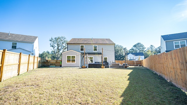 back of house with a lawn, a pergola, and an outdoor hangout area