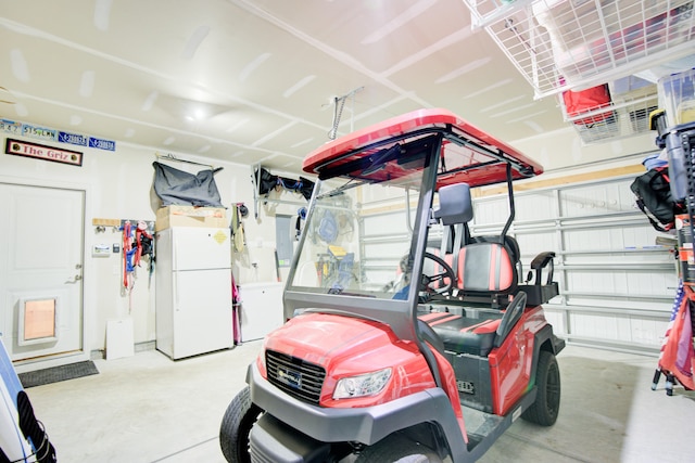 garage with white fridge