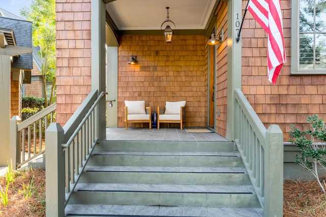 entrance to property featuring a porch