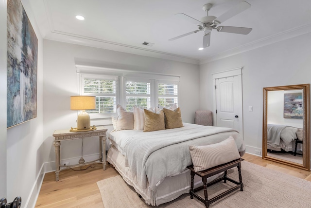 bedroom featuring ornamental molding, ceiling fan, and light hardwood / wood-style floors