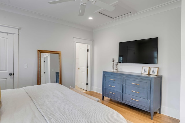 bedroom with crown molding, light hardwood / wood-style flooring, and ceiling fan