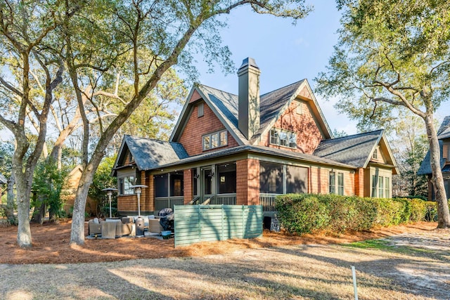 view of front of home featuring a sunroom