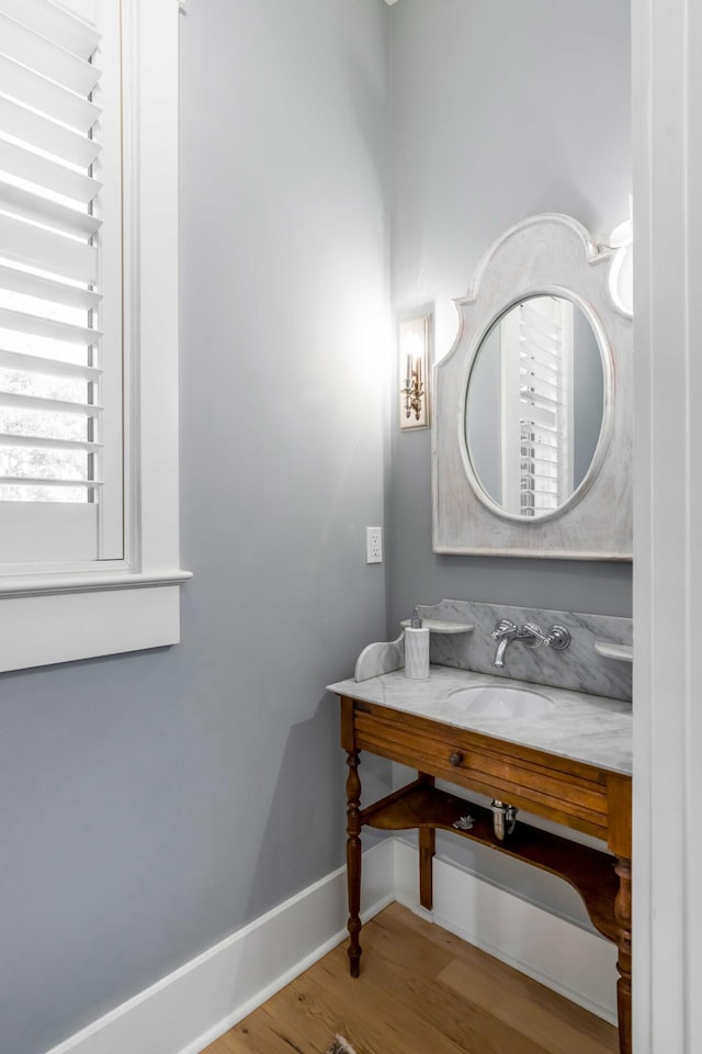 bathroom featuring sink and hardwood / wood-style floors