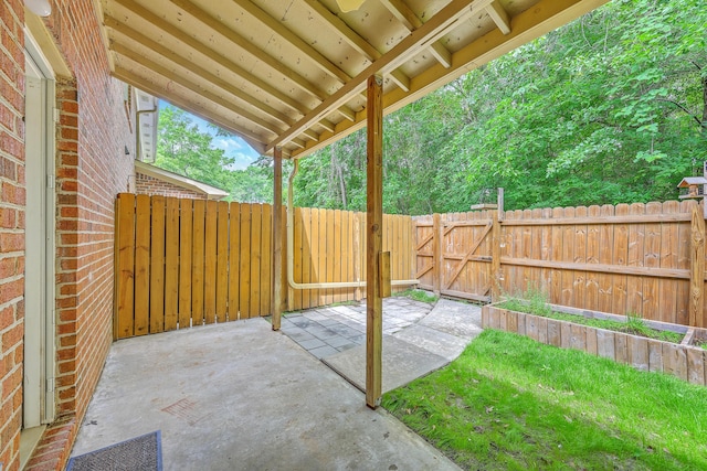 view of patio / terrace with a fenced backyard and a gate