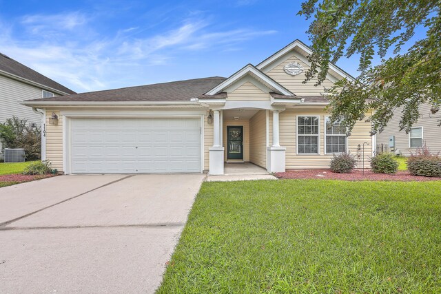 view of front of property featuring a garage, central air condition unit, and a front yard