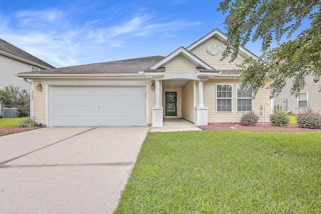 view of front of property featuring a garage, central air condition unit, and a front yard