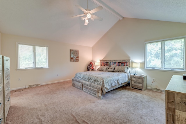 carpeted bedroom featuring beamed ceiling, high vaulted ceiling, multiple windows, and ceiling fan