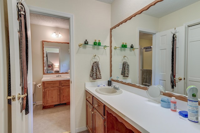 bathroom featuring vanity and a textured ceiling