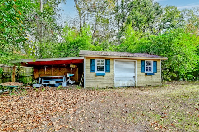 view of outbuilding with a carport