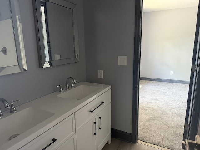 109 NW Haddock Rd, Orangeburg, SC 29115 - bathroom featuring double vanity and baseboards