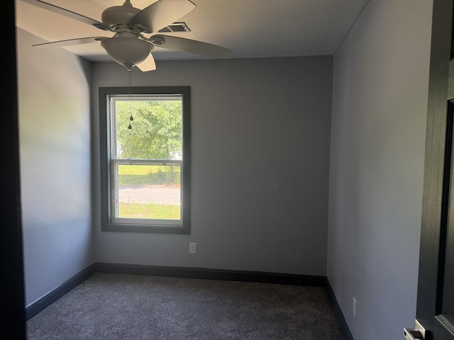 109 NW Haddock Rd, Orangeburg, SC 29115 - unfurnished room with dark colored carpet, a ceiling fan, and baseboards
