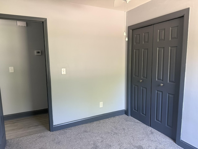 109 NW Haddock Rd, Orangeburg, SC 29115 - unfurnished bedroom featuring a closet, baseboards, and carpet