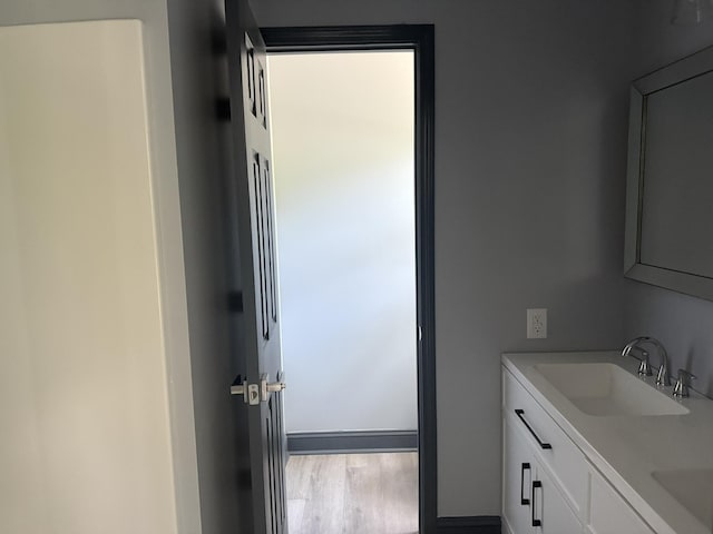 109 NW Haddock Rd, Orangeburg, SC 29115 - bathroom featuring double vanity and wood finished floors