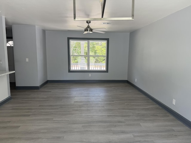 109 NW Haddock Rd, Orangeburg, SC 29115 - spare room with ceiling fan, baseboards, and wood finished floors