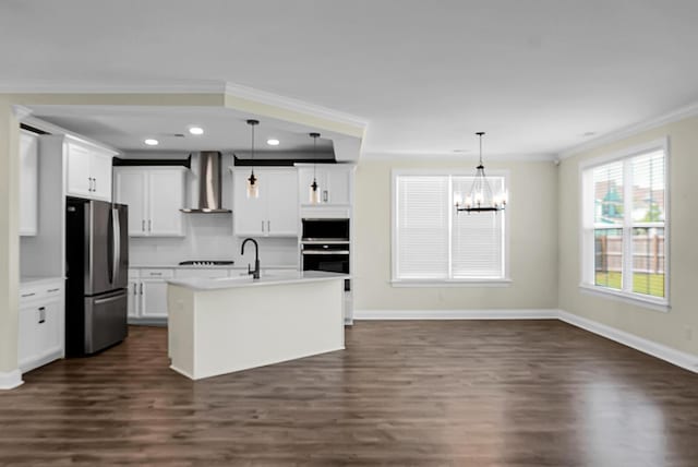 661 Black Pine Rd, Moncks Corner, SC 29461 - kitchen with stainless steel appliances, wall chimney range hood, dark wood-style floors, a chandelier, and baseboards