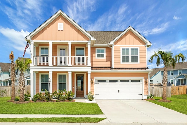 661 Black Pine Rd, Moncks Corner, SC 29461 - view of front of property featuring board and batten siding, a standing seam roof, driveway, a garage, and a balcony