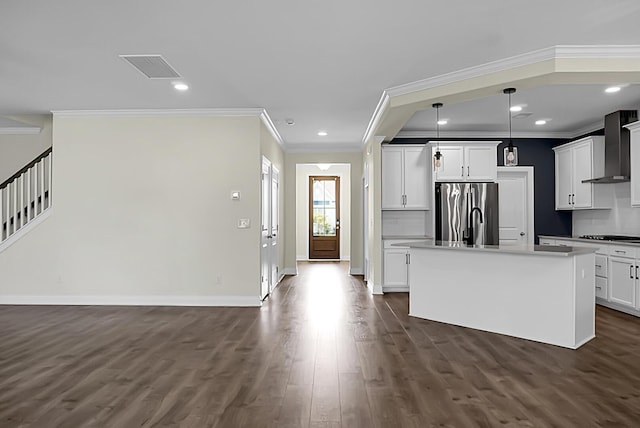 661 Black Pine Rd, Moncks Corner, SC 29461 - kitchen featuring freestanding refrigerator, crown molding, wall chimney exhaust hood, dark wood finished floors, and a center island with sink