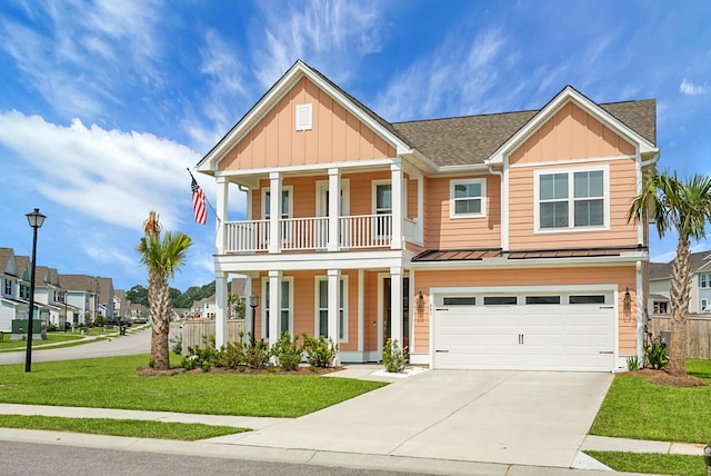 661 Black Pine Rd, Moncks Corner, SC 29461 - view of front facade with covered porch, board and batten siding, driveway, a front lawn, and an attached garage