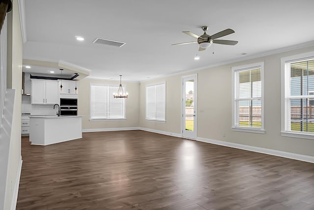 661 Black Pine Rd, Moncks Corner, SC 29461 - unfurnished living room with ornamental molding, recessed lighting, dark wood-style flooring, a chandelier, and baseboards