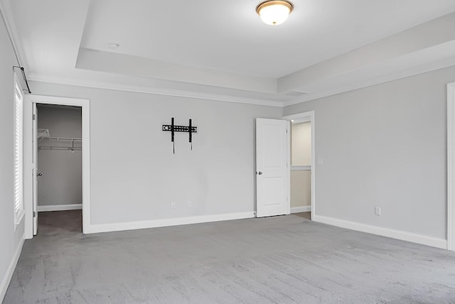661 Black Pine Rd, Moncks Corner, SC 29461 - unfurnished bedroom with a raised ceiling, carpet floors, baseboards, and a walk in closet