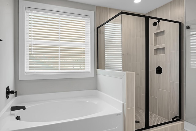 661 Black Pine Rd, Moncks Corner, SC 29461 - bathroom with a bath, a shower stall, and recessed lighting