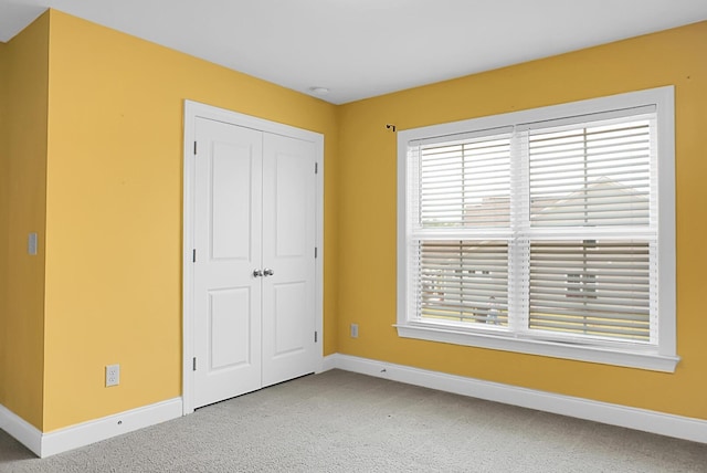 661 Black Pine Rd, Moncks Corner, SC 29461 - unfurnished bedroom featuring light colored carpet, baseboards, and a closet
