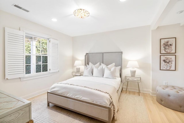 bedroom with light hardwood / wood-style flooring