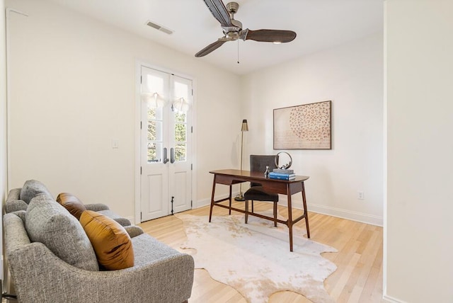 office space with ceiling fan and light hardwood / wood-style flooring