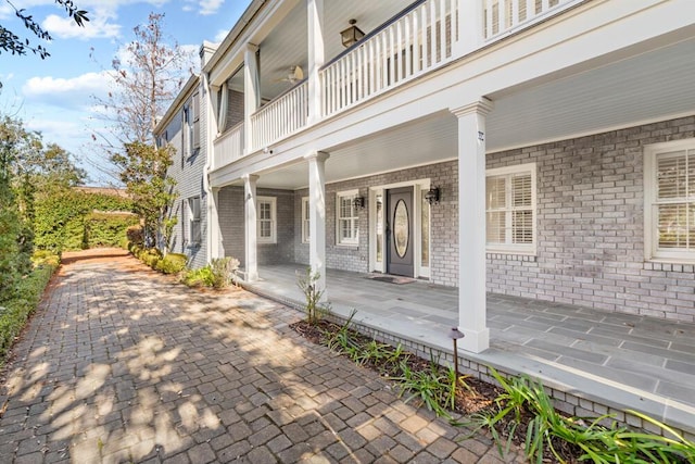 entrance to property featuring covered porch