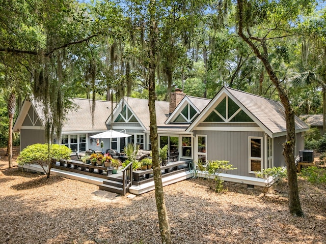 2500 The Bent Twig, Seabrook Island, SC 29455 - rear view of property featuring crawl space, cooling unit, a chimney, roof with shingles, and a wooden deck