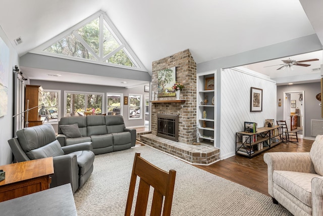 2500 The Bent Twig, Seabrook Island, SC 29455 - living room featuring wood finished floors, a fireplace, ceiling fan, baseboards, and high vaulted ceiling