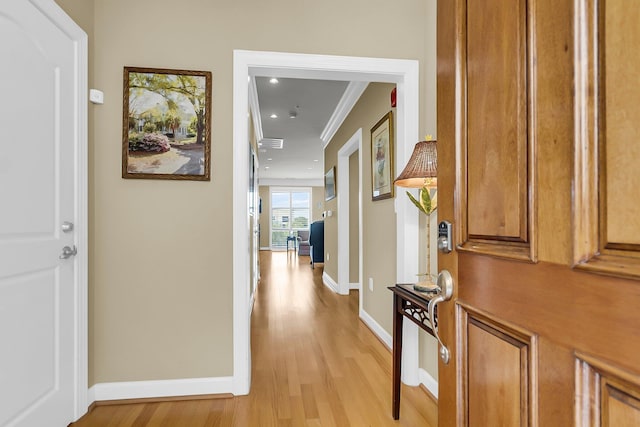 225 Seven Farms Dr Unit 307, Daniel Island, SC 29492 - hall with light wood-type flooring, ornamental molding, and recessed lighting