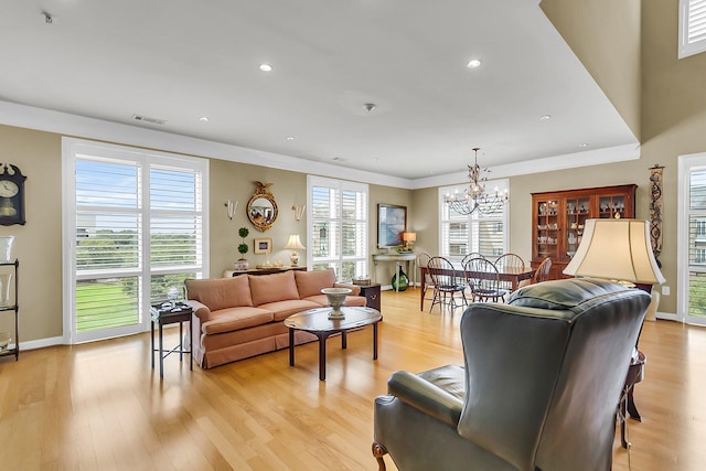 225 Seven Farms Dr Unit 307, Daniel Island, SC 29492 - living area with a chandelier, light wood-style floors, ornamental molding, and recessed lighting