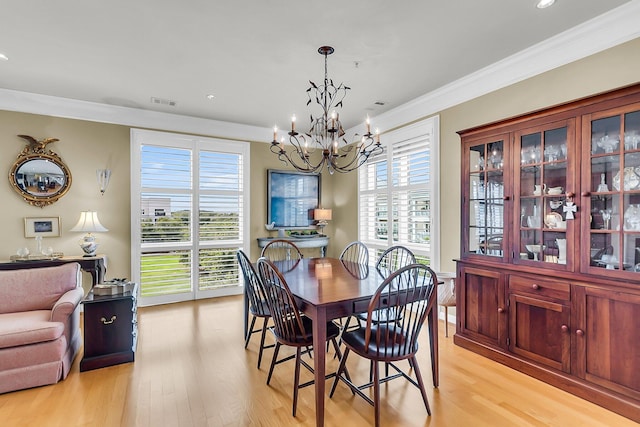 225 Seven Farms Dr Unit 307, Daniel Island, SC 29492 - dining space featuring a chandelier, light wood-style floors, ornamental molding, and recessed lighting