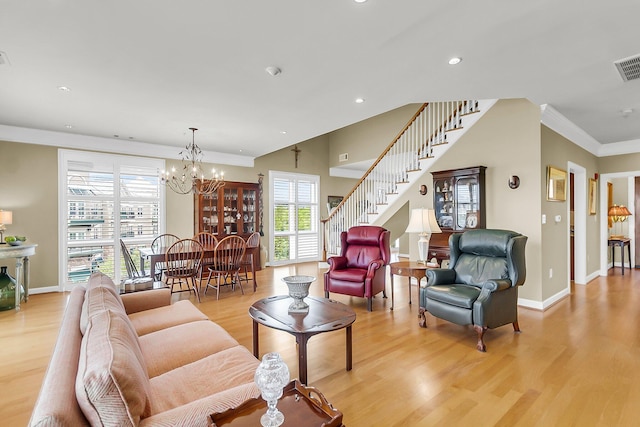 225 Seven Farms Dr Unit 307, Daniel Island, SC 29492 - living area featuring stairway, light wood finished floors, recessed lighting, a chandelier, and ornamental molding