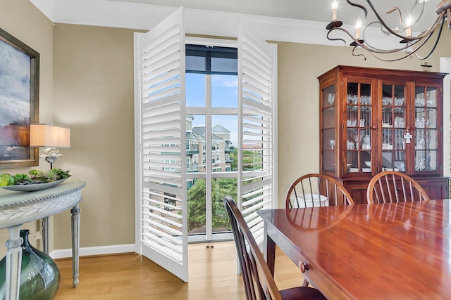 225 Seven Farms Dr Unit 307, Daniel Island, SC 29492 - dining room featuring a chandelier and light wood-type flooring