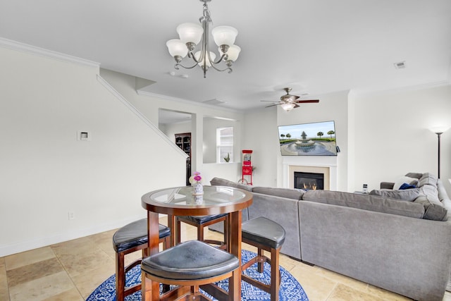145 Woodbrook Way, Moncks Corner, SC 29461 - dining area with a glass covered fireplace, a chandelier, crown molding, ceiling fan, and baseboards