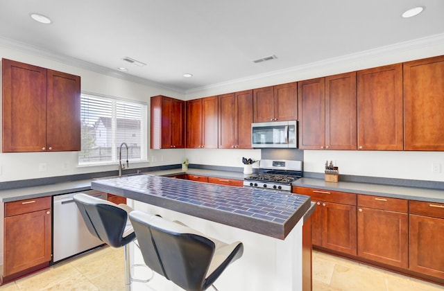 145 Woodbrook Way, Moncks Corner, SC 29461 - kitchen featuring appliances with stainless steel finishes, dark countertops, crown molding, a sink, and recessed lighting