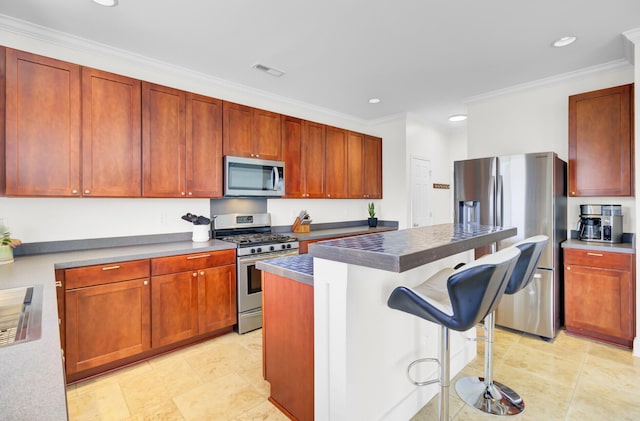 145 Woodbrook Way, Moncks Corner, SC 29461 - kitchen with stainless steel appliances, a kitchen breakfast bar, crown molding, recessed lighting, and a center island