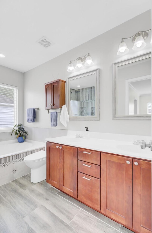 145 Woodbrook Way, Moncks Corner, SC 29461 - bathroom with toilet, double vanity, and a bathtub