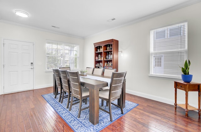 145 Woodbrook Way, Moncks Corner, SC 29461 - dining space with crown molding, dark wood-style flooring, and baseboards