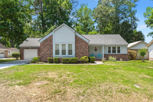 204 Runnymede Ln, Summerville, SC 29485 - view of front facade with brick siding, asphalt driveway, an attached garage, a front lawn, and roof with shingles