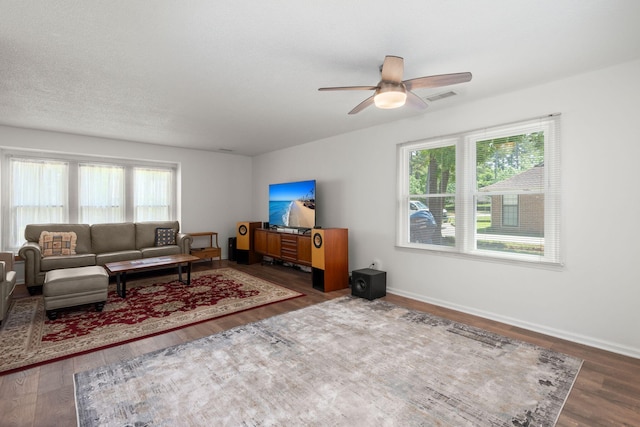 204 Runnymede Ln, Summerville, SC 29485 - living room with healthy amount of natural light, wood finished floors, ceiling fan, and baseboards